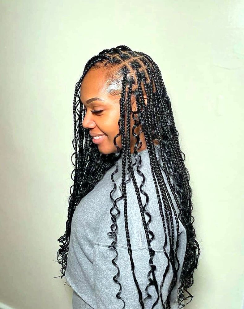 Knotless boho braids with curly ends, side view