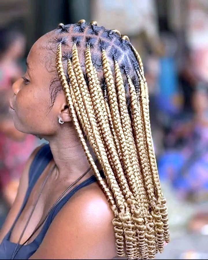 Blonde box braids with curly ends