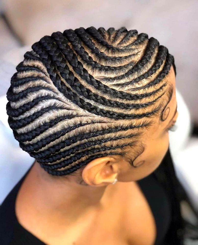 Curved cornrows, side view