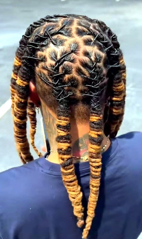 Dreadlocks with golden tips, seen from behind