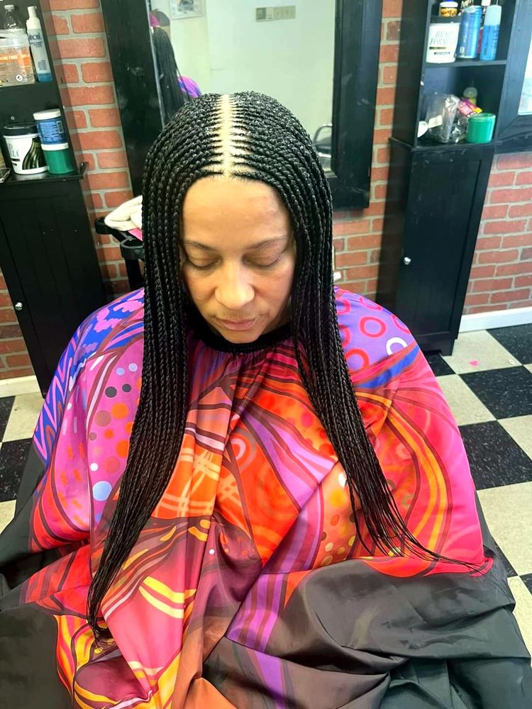 Long knotless braids with a middle part