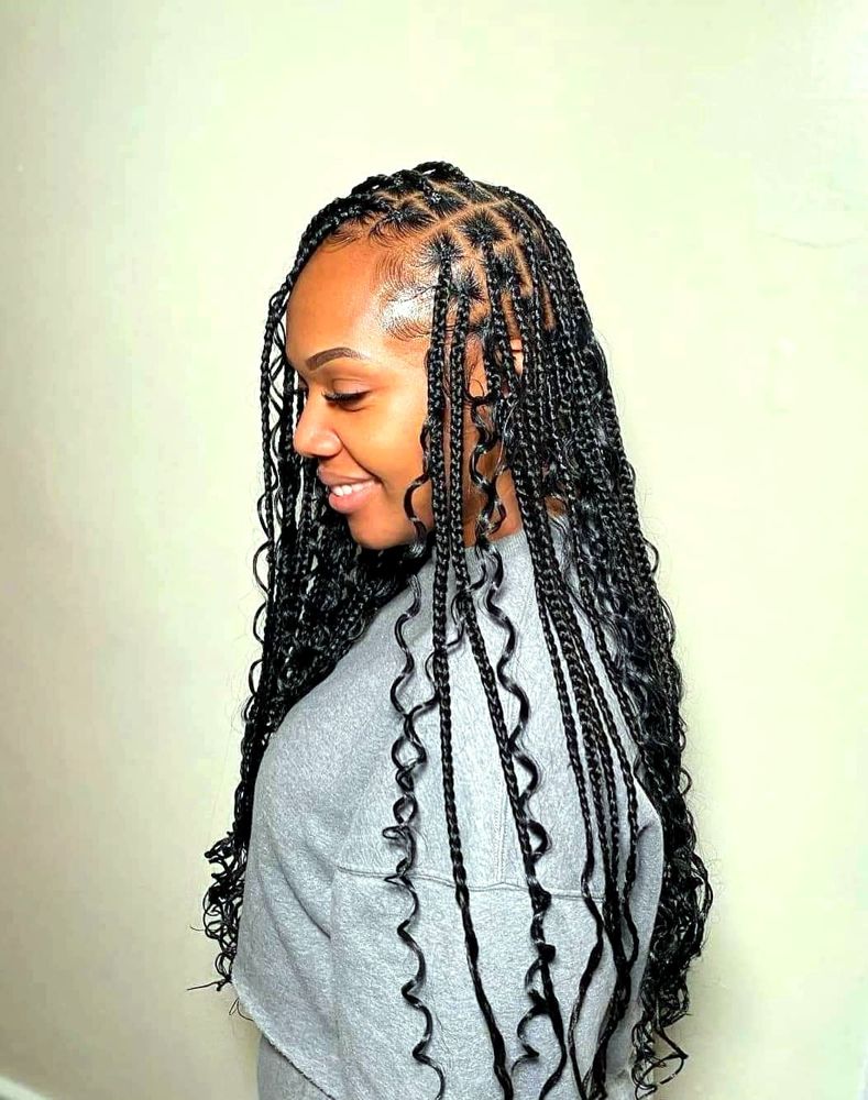 Knotless braids with curly ends, side view