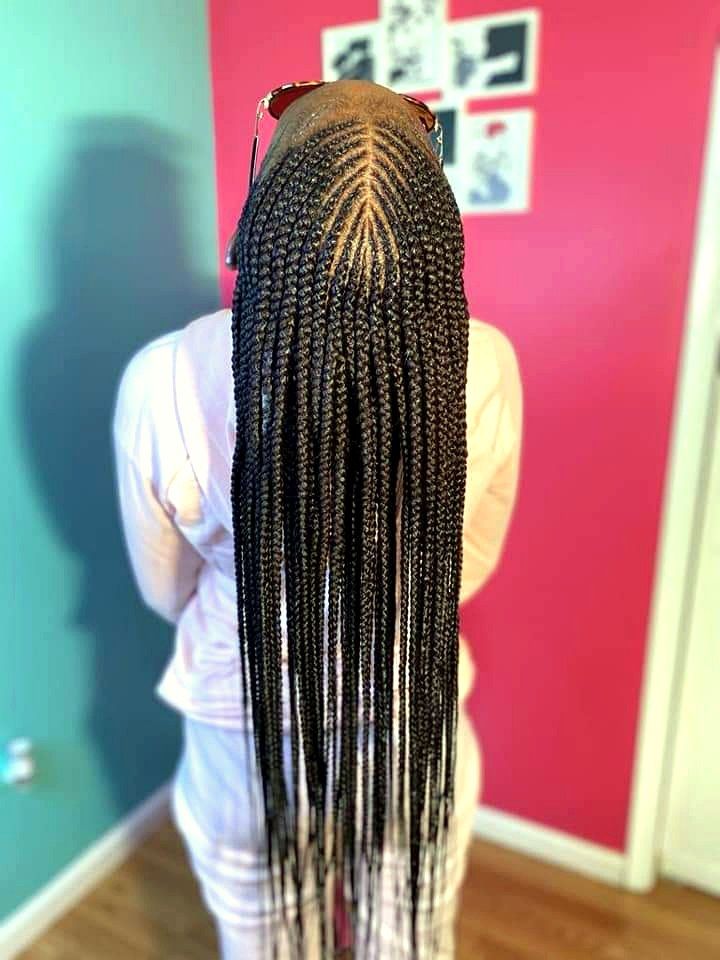 Long cornrows braided from the crown to the ends, seen from behind