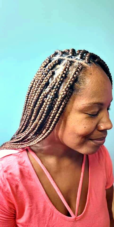Medium box braids in copper brown, side view