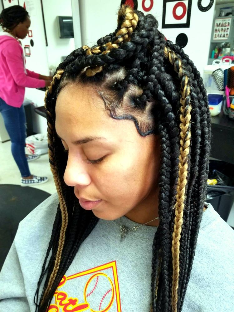 Large box braids in black with honey blonde highlights